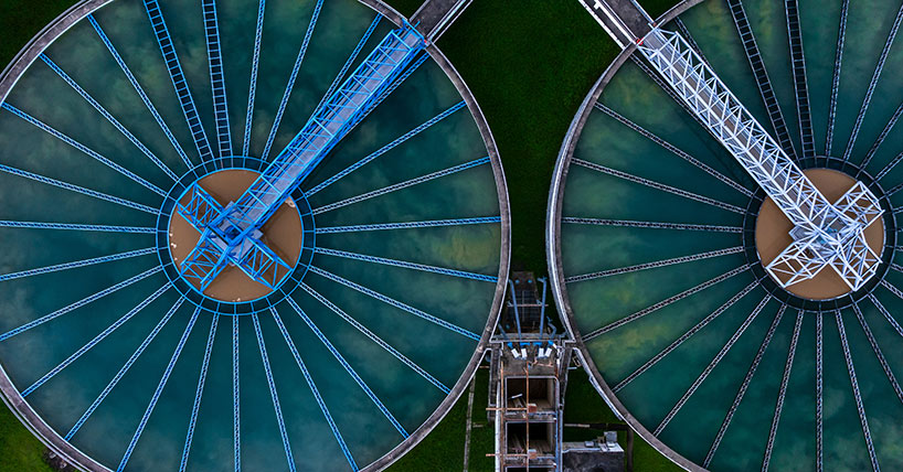 Aerial view circular clarifier tank at wastewater treatment plant,