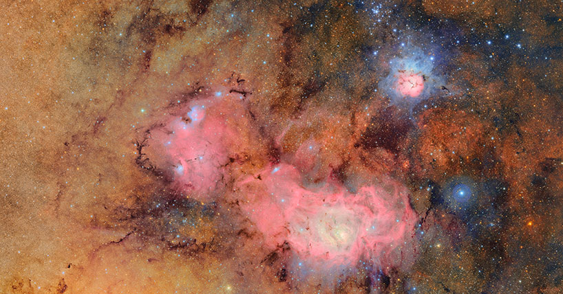 This image combines 678 separate images taken by NSF-DOE Vera C. Rubin Observatory in just over seven hours of observing time. Combining many images in this way clearly reveals otherwise faint or invisible details, such as the clouds of gas and dust that comprise the Trifid nebula (top right) and the Lagoon nebula, which are several thousand light-years away from Earth.