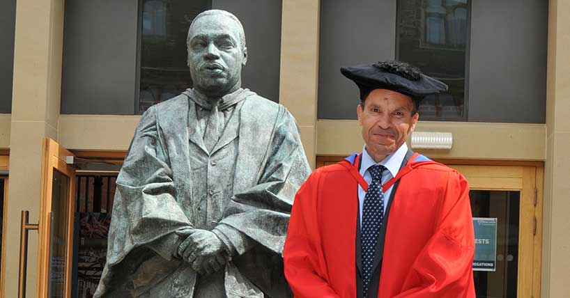 Professor Richard Oreffo next to Newcastle University's Martin Luther King statue