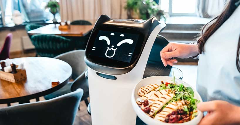 A photograph of a robot waiter in a restaurant